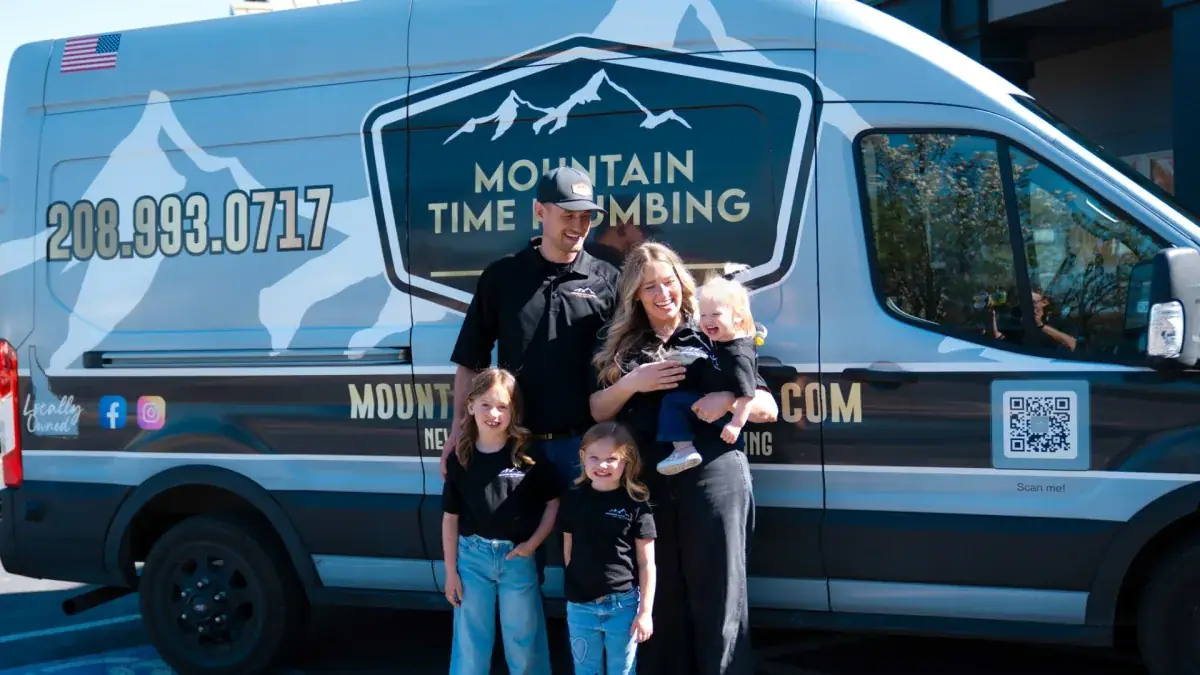 Mountain Time Plumbing family in front of service van